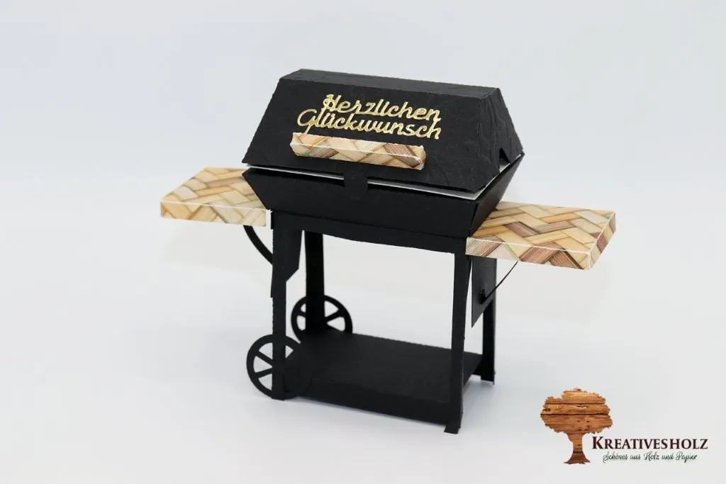 Geschenkverpackung in Form eines Grillwagens